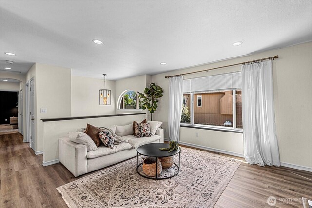 1324 Fairhaven Ave, Wenatchee, WA 98801 - living area featuring wood finished floors, baseboards, recessed lighting, and a chandelier