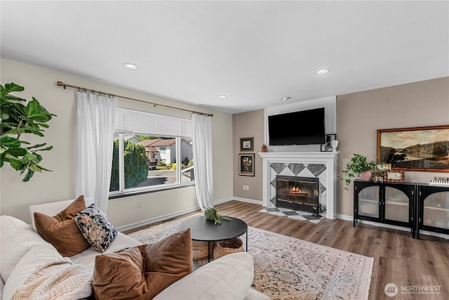 1324 Fairhaven Ave, Wenatchee, WA 98801 - living area with wood finished floors, a tile fireplace, recessed lighting, and baseboards