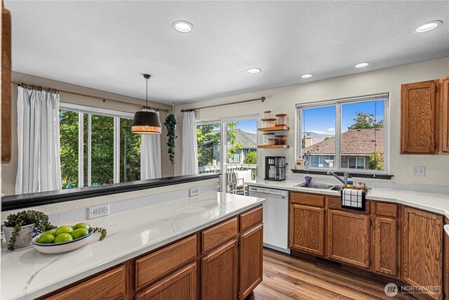 1324 Fairhaven Ave, Wenatchee, WA 98801 - kitchen with white dishwasher, plenty of natural light, a sink, recessed lighting, and a textured ceiling