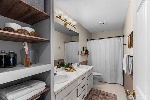 1324 Fairhaven Ave, Wenatchee, WA 98801 - full bath with toilet, double vanity, tile patterned flooring, and curtained shower