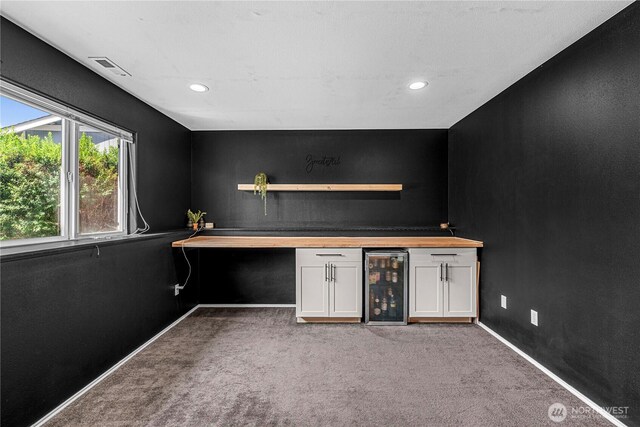 1324 Fairhaven Ave, Wenatchee, WA 98801 - indoor dry bar featuring wine cooler, carpet flooring, baseboards, and recessed lighting