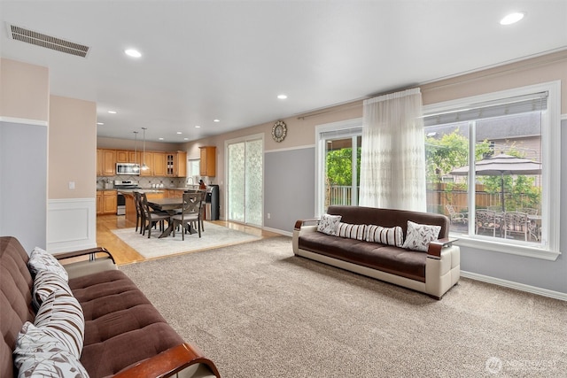 13327 SE 279th Pl, Kent, WA 98042 - living room featuring light colored carpet, recessed lighting, and baseboards