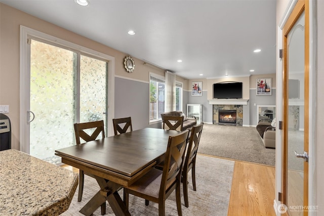 13327 SE 279th Pl, Kent, WA 98042 - dining room with a glass covered fireplace, recessed lighting, and light wood finished floors