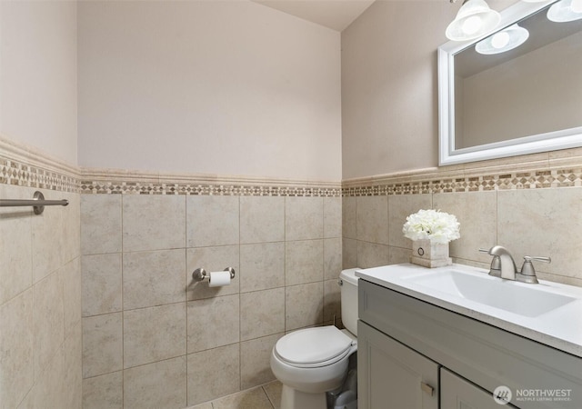 13327 SE 279th Pl, Kent, WA 98042 - bathroom with toilet, tile walls, vanity, and wainscoting