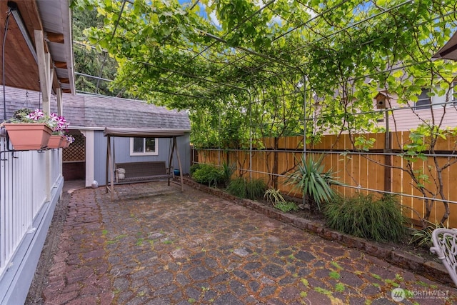 13327 SE 279th Pl, Kent, WA 98042 - fenced backyard featuring an outdoor structure and a patio area