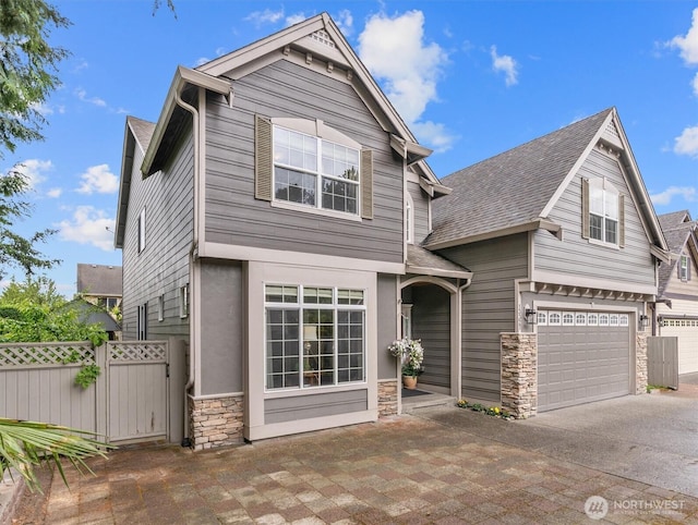 13327 SE 279th Pl, Kent, WA 98042 - view of front facade featuring stone siding, driveway, a shingled roof, and an attached garage