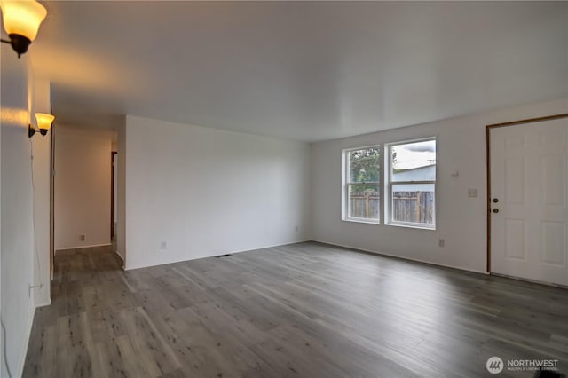 866 112th St S, Parkland, WA 98444 - unfurnished living room with wood finished floors