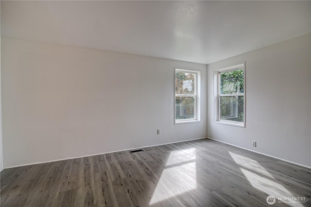 866 112th St S, Parkland, WA 98444 - unfurnished room with wood finished floors and baseboards