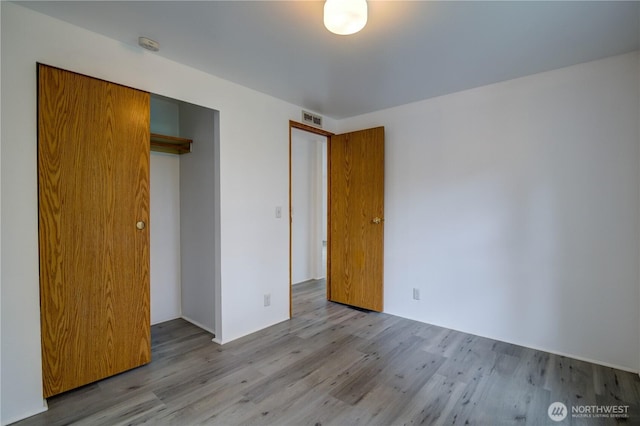 866 112th St S, Parkland, WA 98444 - unfurnished bedroom with wood finished floors and a closet