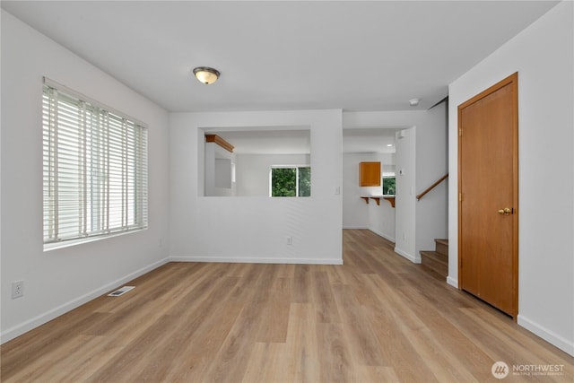 4817 SE 147th Pl, Everett, WA 98208 - spare room with light wood-style floors, stairs, and baseboards