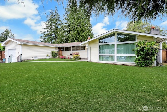 7211 S Sheridan Ave, Tacoma, WA 98408 - view of front of house featuring a front lawn and a garage