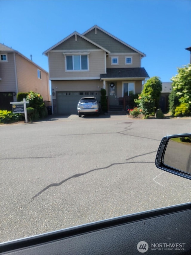 3829 134th Pl SW, Lynnwood, WA 98087 - view of front of house featuring an attached garage and driveway