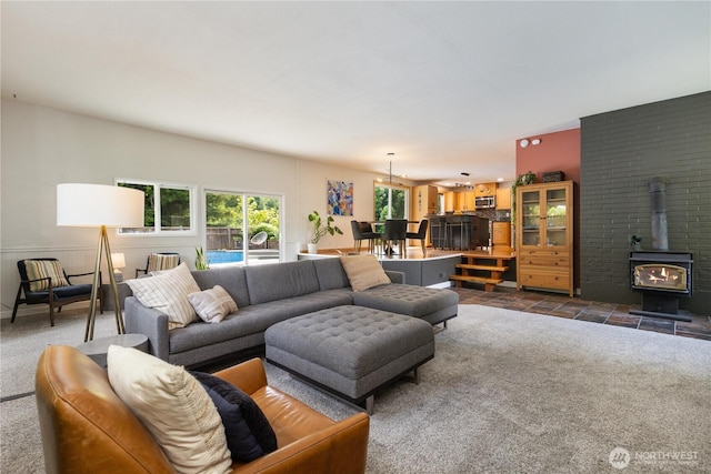 26933 NE Cherry St, Duvall, WA 98019 - living room featuring a wood stove and dark colored carpet