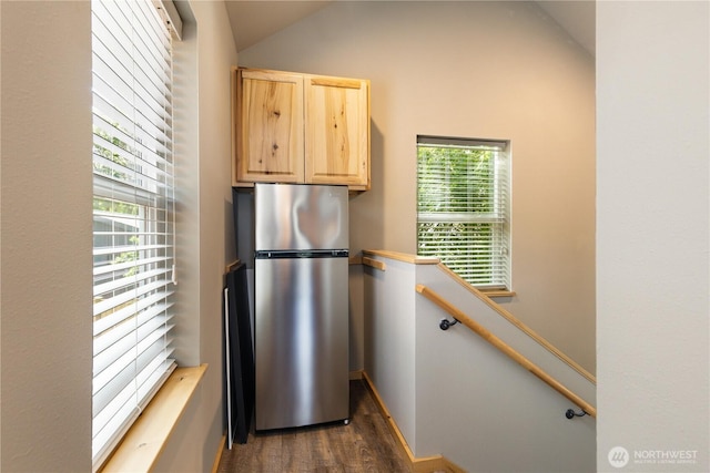 26933 NE Cherry St, Duvall, WA 98019 - kitchen featuring freestanding refrigerator, light brown cabinetry, dark wood-style flooring, lofted ceiling, and baseboards