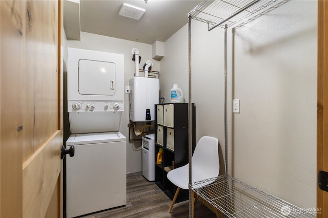 26933 NE Cherry St, Duvall, WA 98019 - laundry room with estacked washer and dryer, dark wood-style flooring, and tankless water heater