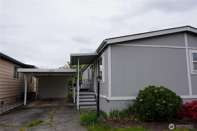 10711 62nd St E Unit 81A, Puyallup, WA 98372 - view of side of home with driveway and an attached carport