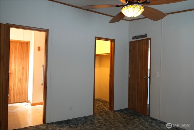 10711 62nd St E Unit 81A, Puyallup, WA 98372 - unfurnished bedroom with a spacious closet, carpet flooring, a closet, and a ceiling fan