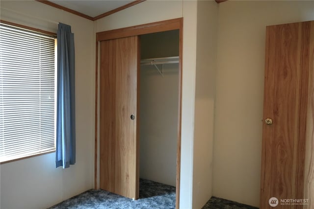 10711 62nd St E Unit 81A, Puyallup, WA 98372 - unfurnished bedroom featuring a closet, carpet floors, and crown molding