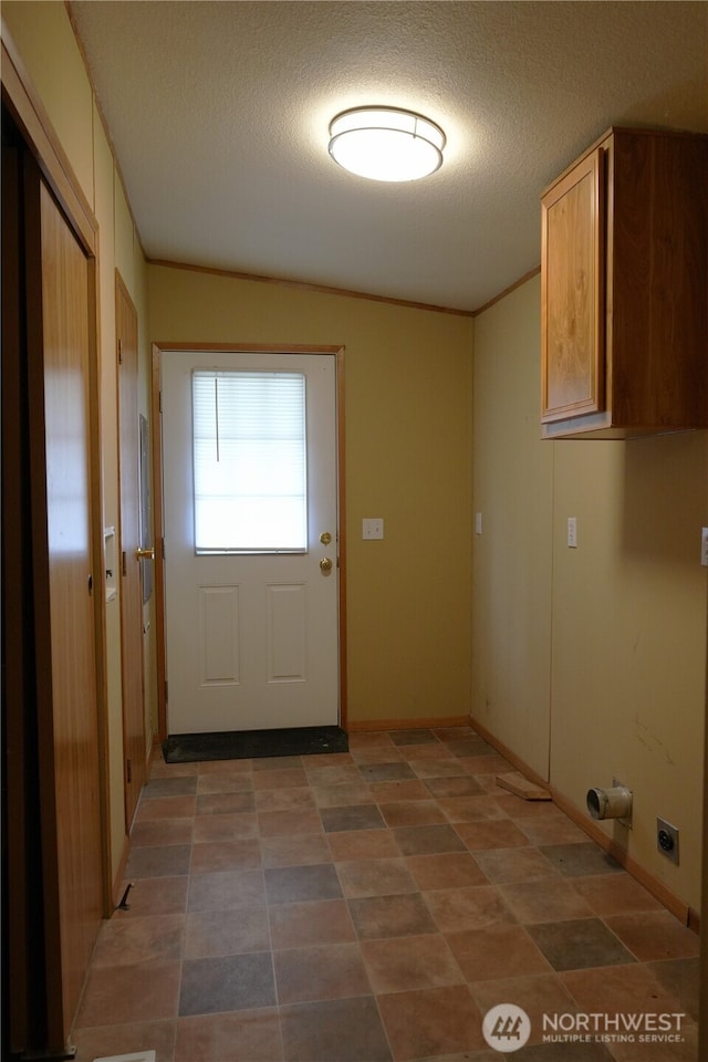 10711 62nd St E Unit 81A, Puyallup, WA 98372 - laundry room featuring cabinet space, a textured ceiling, and hookup for an electric dryer