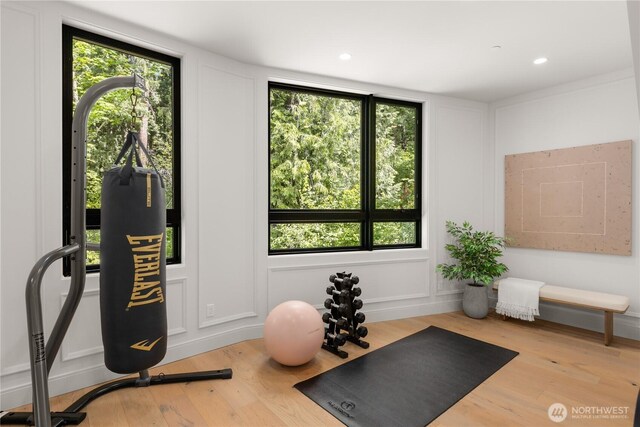 7116 NE 119th Ln, Kirkland, WA 98034 - exercise area with a decorative wall, wood finished floors, and recessed lighting