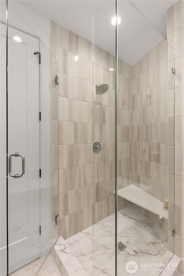 7116 NE 119th Ln, Kirkland, WA 98034 - bathroom featuring a stall shower and marble finish flooring