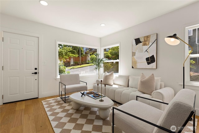 2614 E Olive St, Seattle, WA 98122 - living room featuring light wood-style flooring, recessed lighting, and baseboards