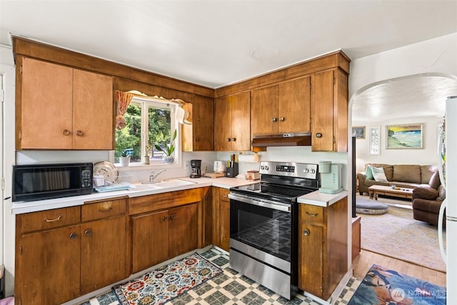 221 NW Nichols Ave, Bremerton, WA 98311 - kitchen featuring electric stove, black microwave, under cabinet range hood, a sink, and light countertops