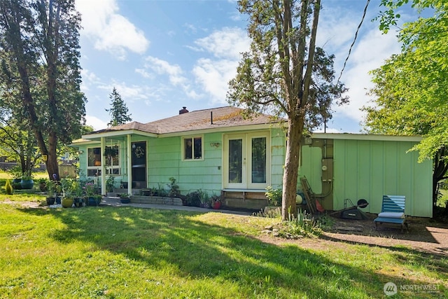 221 NW Nichols Ave, Bremerton, WA 98311 - rear view of house with a yard and board and batten siding