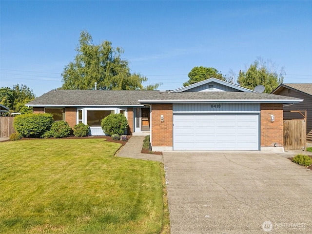 6410 151st Ave E, Sumner, WA 98390 - single story home featuring brick siding, a garage, and driveway