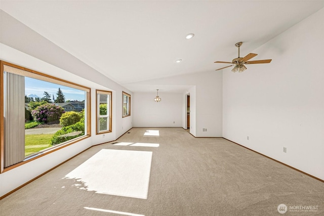 6410 151st Ave E, Sumner, WA 98390 - carpeted spare room featuring a chandelier, vaulted ceiling, baseboards, and a ceiling fan