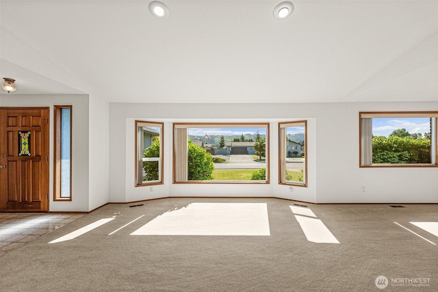 6410 151st Ave E, Sumner, WA 98390 - foyer featuring carpet, lofted ceiling, and baseboards