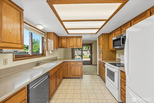 6410 151st Ave E, Sumner, WA 98390 - kitchen with appliances with stainless steel finishes, a sink, light flooring, and healthy amount of natural light