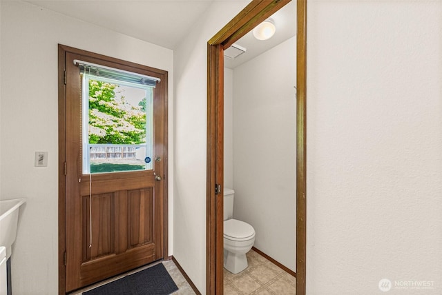 6410 151st Ave E, Sumner, WA 98390 - doorway to outside featuring baseboards