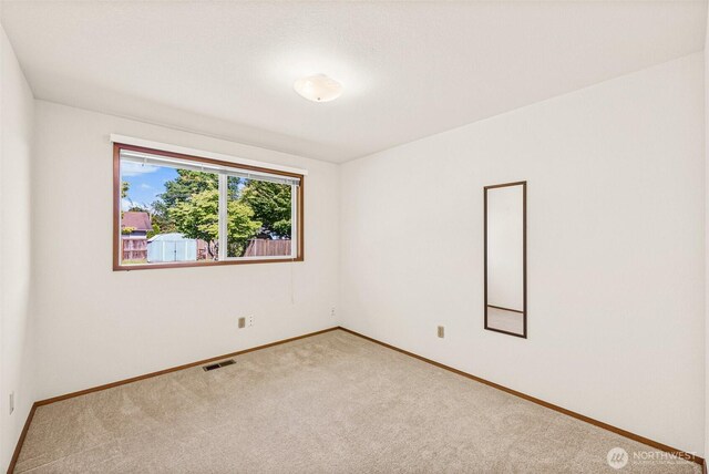 6410 151st Ave E, Sumner, WA 98390 - carpeted empty room featuring baseboards
