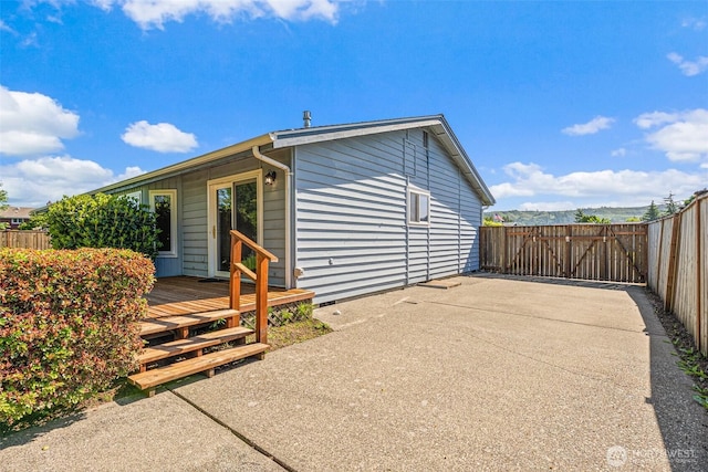 6410 151st Ave E, Sumner, WA 98390 - rear view of house featuring a wooden deck