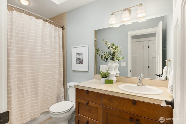 3029 Yankee Girl Cir NE, Bainbridge Island, WA 98110 - bathroom with vanity, toilet, and a shower with shower curtain