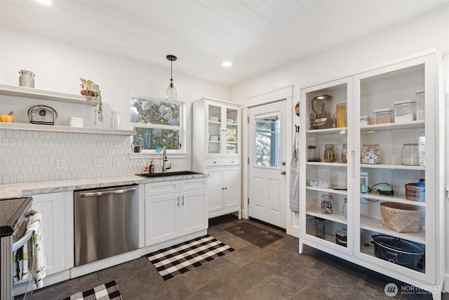 1102 Tecumseh St, Aberdeen, WA 98520 - kitchen with appliances with stainless steel finishes, a sink, white cabinetry, light stone countertops, and backsplash