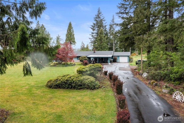 1487 Centralia Alpha Rd, Chehalis, WA 98532 - ranch-style house with a front yard, driveway, and a garage