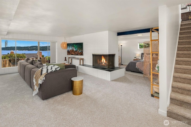 4910 NE 86th St, Seattle, WA 98115 - carpeted living area with stairway and a multi sided fireplace