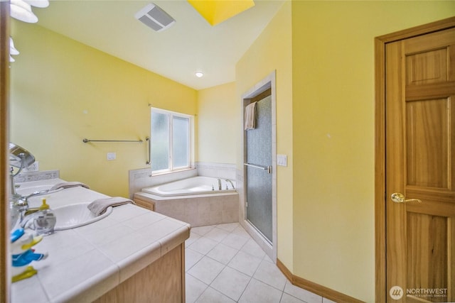 8151 E Seaview Dr, Port Orchard, WA 98366 - full bath featuring tile patterned flooring, a garden tub, a stall shower, a sink, and baseboards