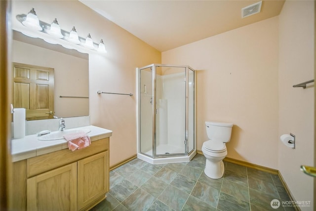 8151 E Seaview Dr, Port Orchard, WA 98366 - bathroom featuring toilet, vanity, a shower stall, and baseboards