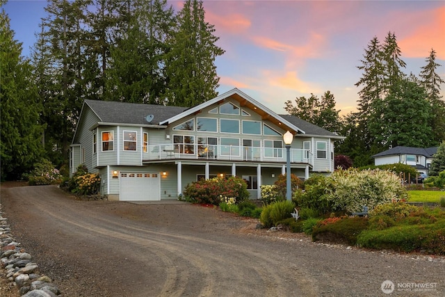 8151 E Seaview Dr, Port Orchard, WA 98366 - rustic home with driveway, an attached garage, and a balcony