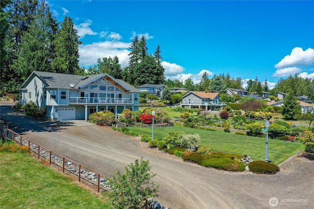 8151 E Seaview Dr, Port Orchard, WA 98366 - view of front of home with driveway, a garage, and a front yard