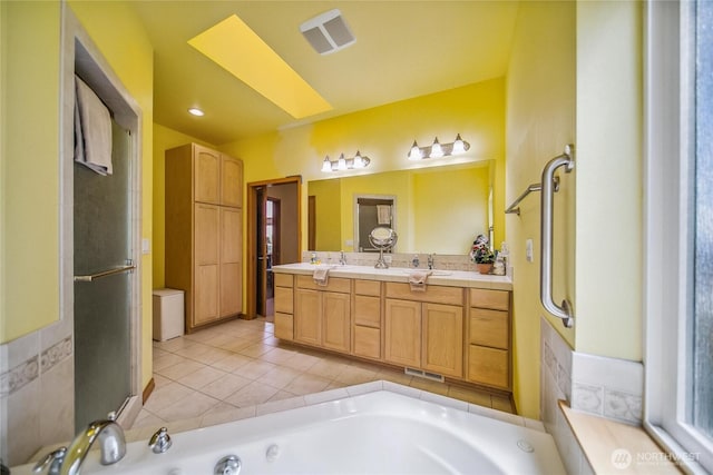 8151 E Seaview Dr, Port Orchard, WA 98366 - full bath featuring double vanity, a jetted tub, and tile patterned floors