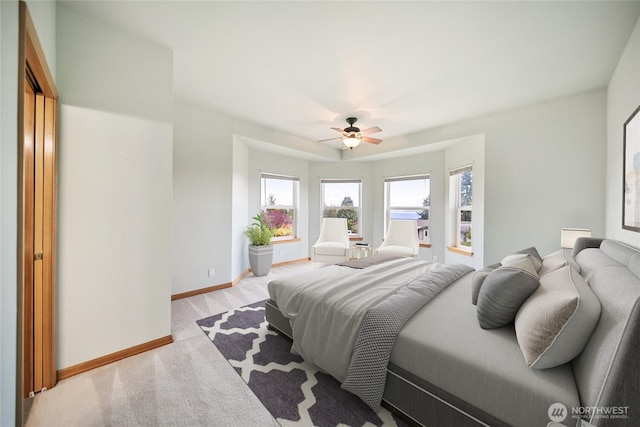 8151 E Seaview Dr, Port Orchard, WA 98366 - bedroom featuring baseboards, a ceiling fan, and light colored carpet