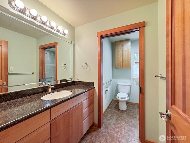 2734 Blue Mountain Rd, Sequim, WA 98362 - bathroom with vanity, toilet, tile patterned flooring, and baseboards