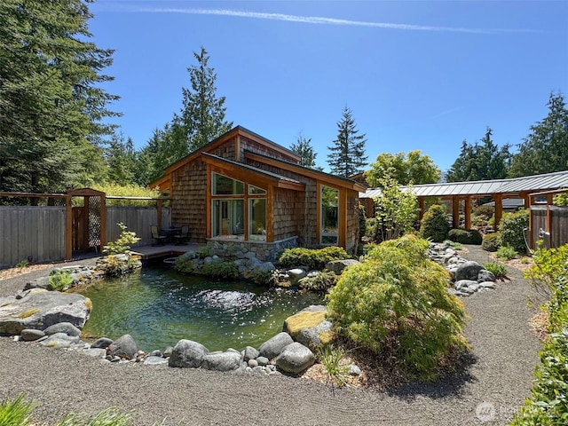 2734 Blue Mountain Rd, Sequim, WA 98362 - rear view of house with a garden pond