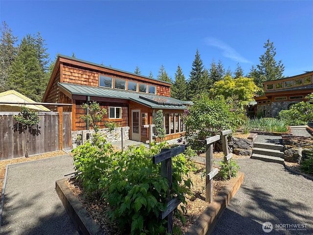 2734 Blue Mountain Rd, Sequim, WA 98362 - back of property with a standing seam roof, a vegetable garden, and metal roof