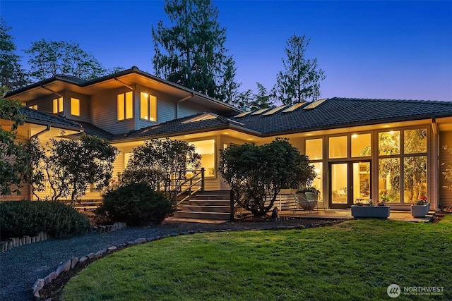 12909 Spanaway Loop Rd S, Tacoma, WA 98444 - back of house featuring a yard, a tile roof, and stairway