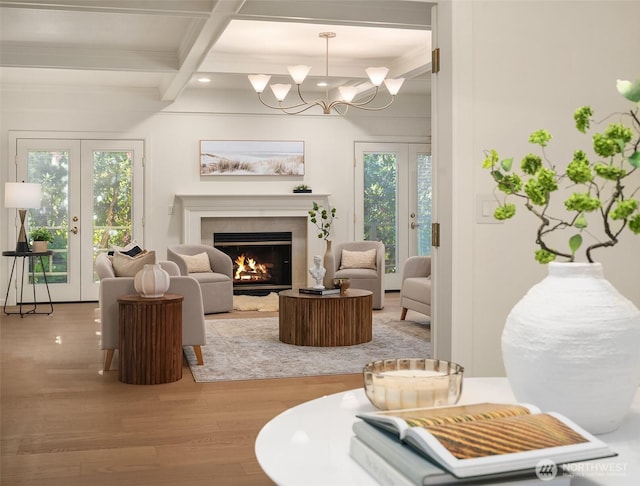 12909 Spanaway Loop Rd S, Tacoma, WA 98444 - living area with french doors, beam ceiling, wood finished floors, a warm lit fireplace, and coffered ceiling